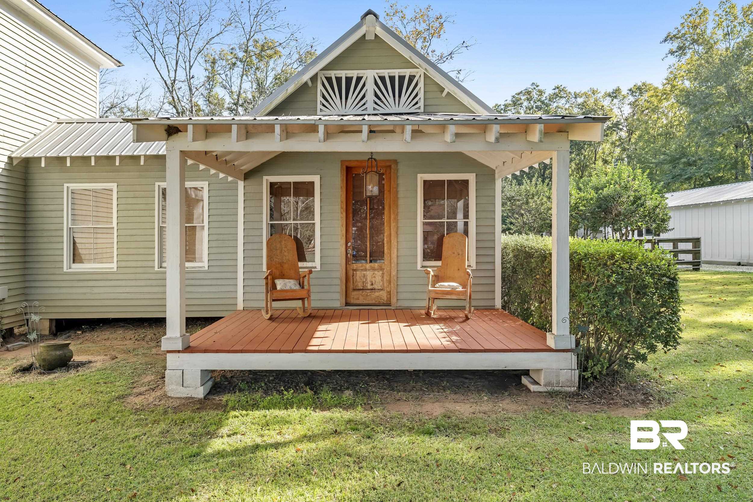 13232 Mary Ann Bch Road Fairhope, AL 36532 - Photo 78 of 79 Back of property with a lawn and a wooden deck