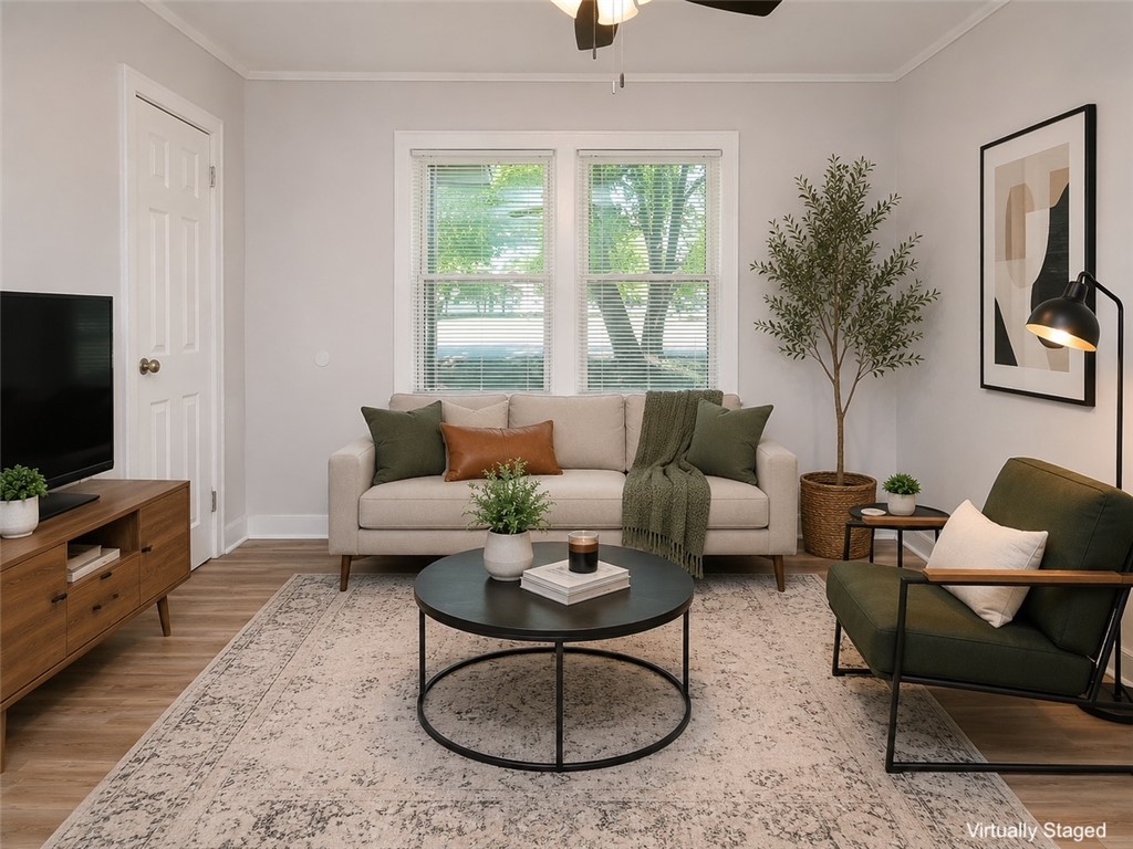 3517 Shawnee Avenue Anderson, SC 29626 - Photo 3 of 25 A well-lit living space features beautiful hardwood floors and a comforting aesthetic.