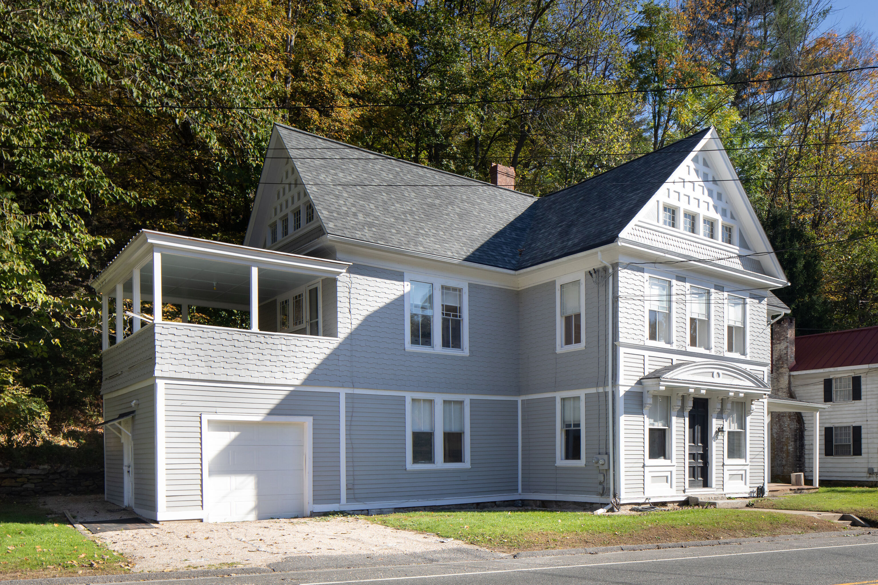 362 Lime Rock Road, Unit B Salisbury, CT 06039 - Photo 1 of 1 a front view of a house with garden