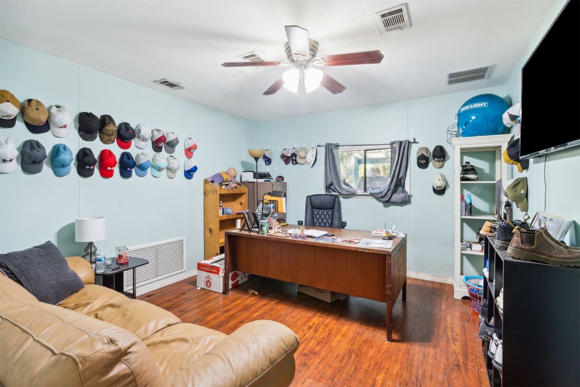 850310 Us Highway Yulee, FL 32097 - Photo 11 of 13 a bedroom with furniture and a flat screen tv