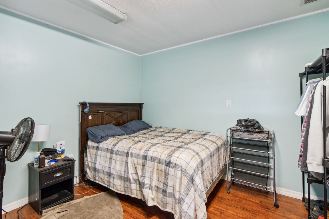 850310 Us Highway Yulee, FL 32097 - Photo 12 of 13 a bedroom with a bed and a chandelier