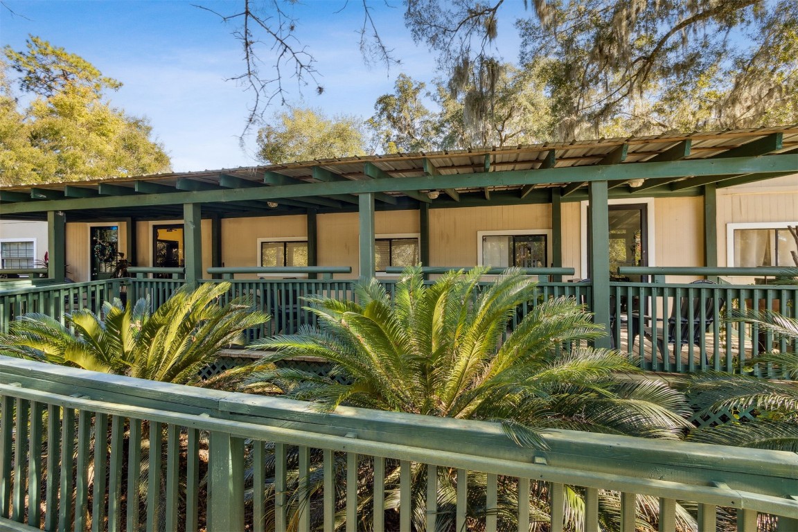 850310 Us Highway Yulee, FL 32097 - Photo 3 of 13 a view of a house with a large window and potted plants