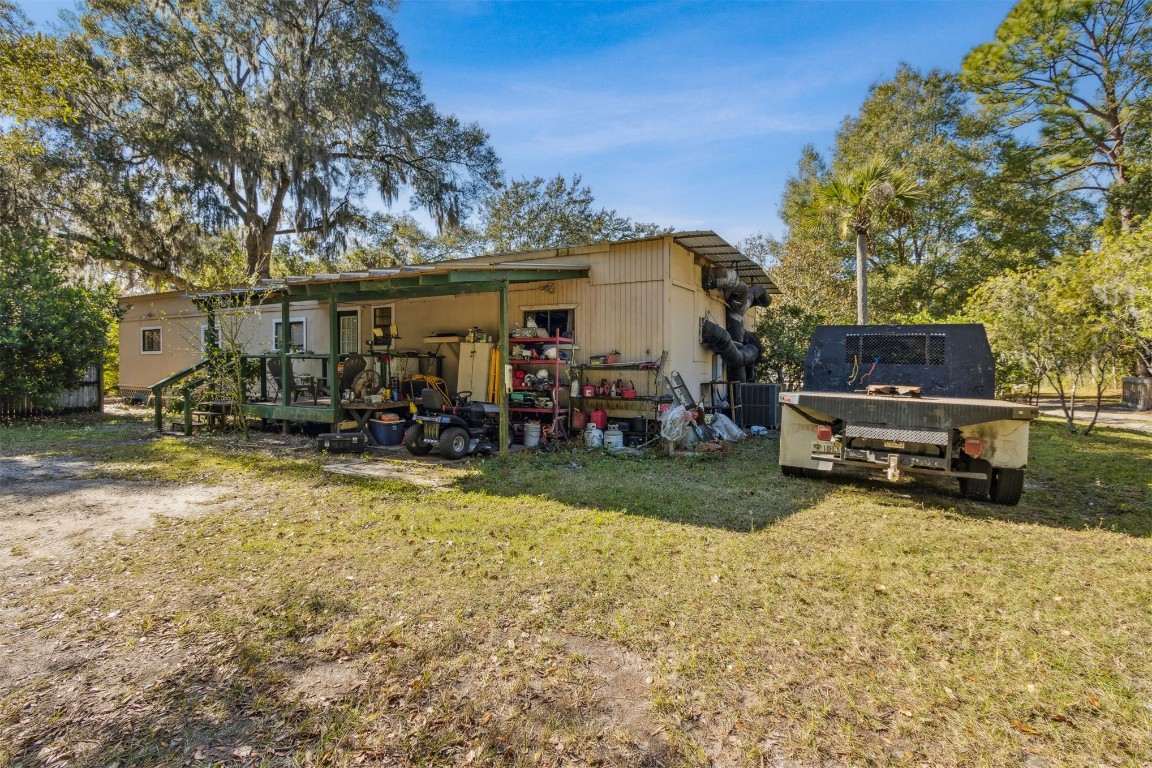 850310 Us Highway Yulee, FL 32097 - Photo 5 of 13 a view of a house with backyard porch and sitting area