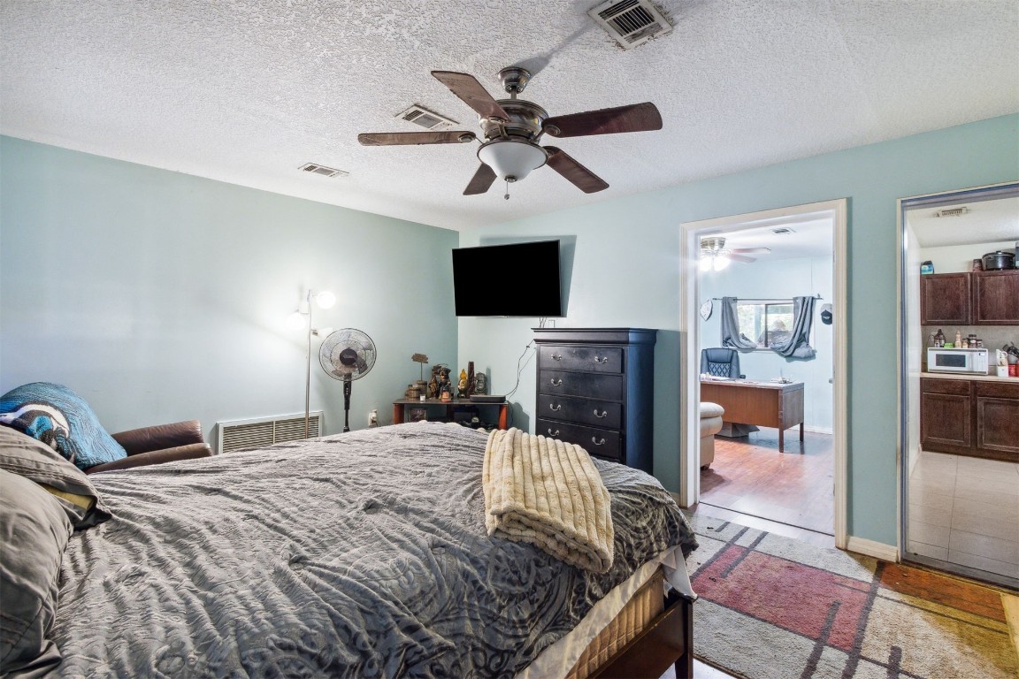 850310 Us Highway Yulee, FL 32097 - Photo 10 of 13 a bedroom with a bed and a flat screen tv