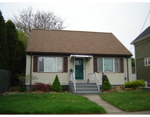 521 Baker Street Fall River, MA 02721 - Photo 1 of 1 a front view of a house with a yard and potted plants