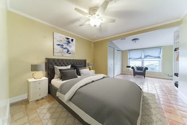 a bedroom with bed and window