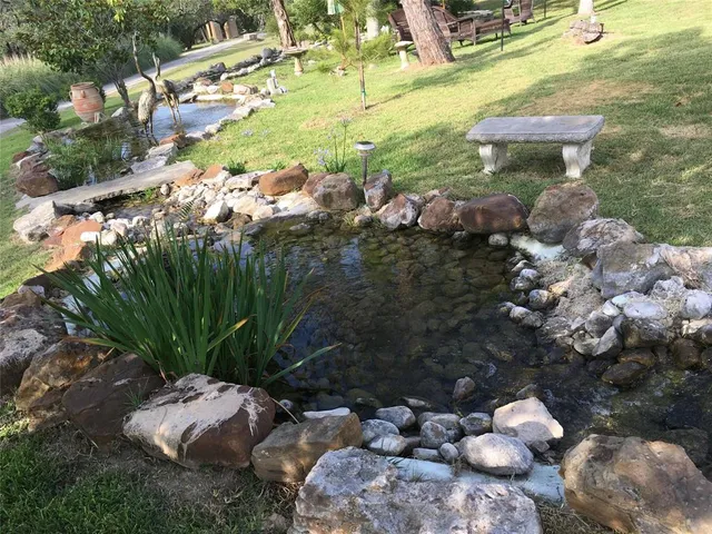 a backyard of a house with lots of green space