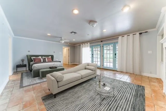 a spacious bedroom with a bed and wooden floor