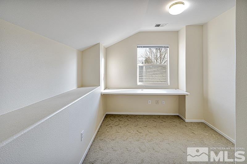1137 Tule Drive Reno, NV 89521 - Photo 14 of 17 a view of room with window and a ceiling fan