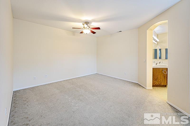 1137 Tule Drive Reno, NV 89521 - Photo 8 of 17 a view of a livingroom with a chandelier fan
