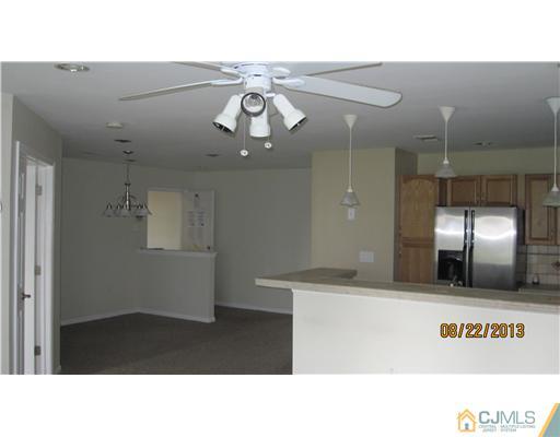 713 Edpas Road New Brunswick, NJ 08901 - Photo 3 of 16 a bathroom with a sink a large mirror and shower