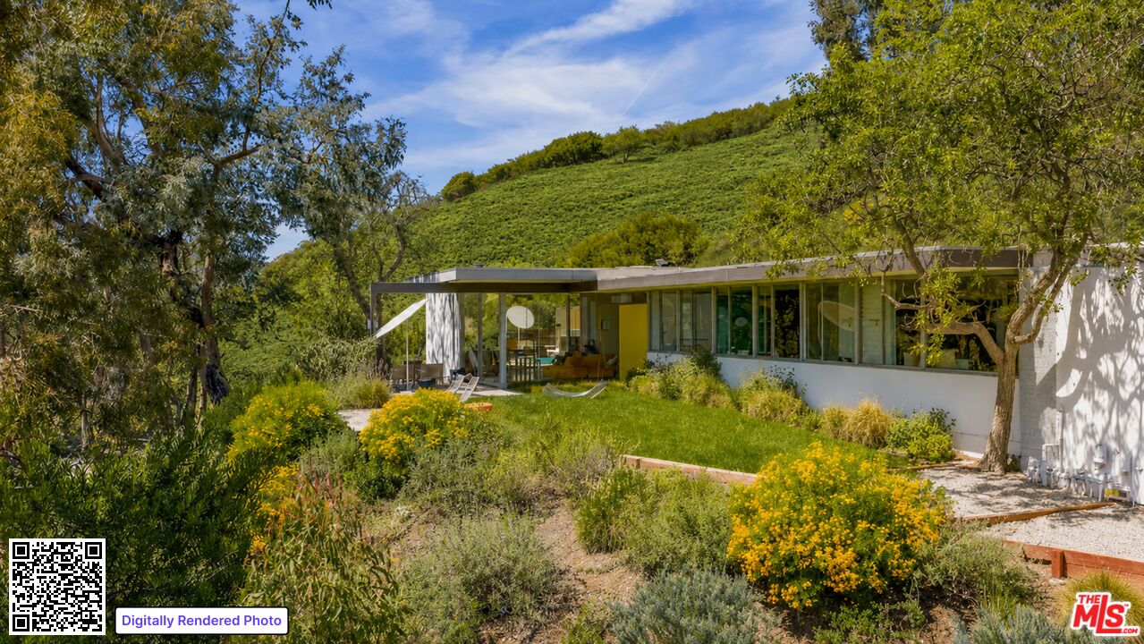1531 North Tigertail Road Los Angeles, CA 90049 - Photo 1 of 24 a view of a house with a yard