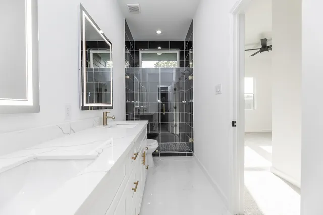 a bathroom with a sink and a shower