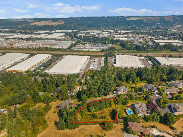 an aerial view of city and lake