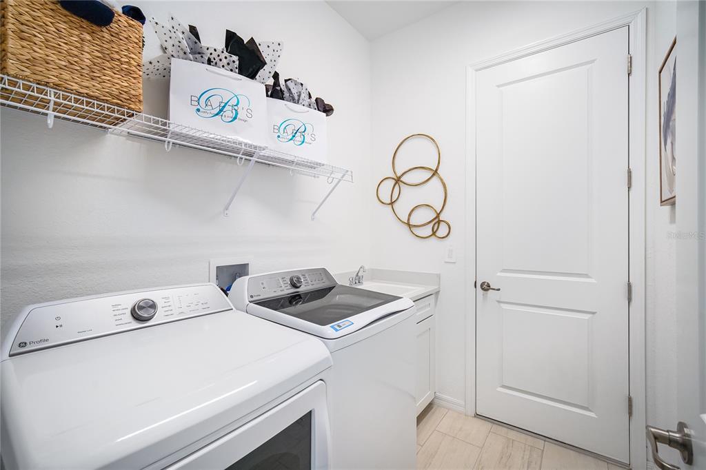 7165 Inlet Isles Lakewood Ranch, FL 34202 - Photo 22 of 26 a utility room with dryer and washer