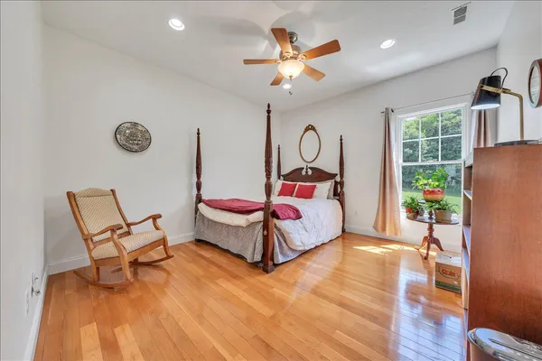 a bed room with a bed and a chandelier