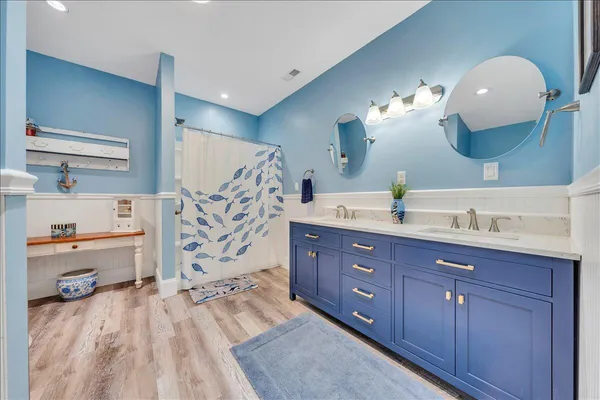 a bathroom with a toilet and a shower curtain
