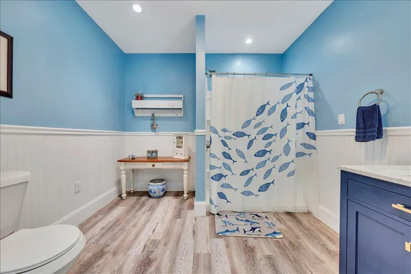 a room with furniture and a wooden floor