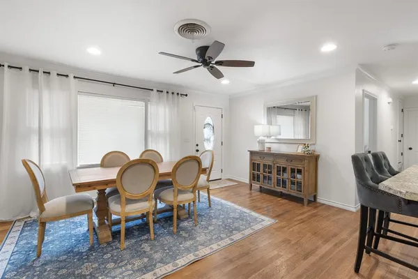 a dining room with furniture and window