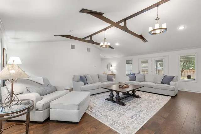 a living room with furniture and a rug