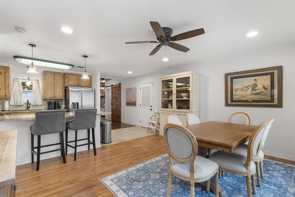 a view of a dining room with furniture window and wooden floor