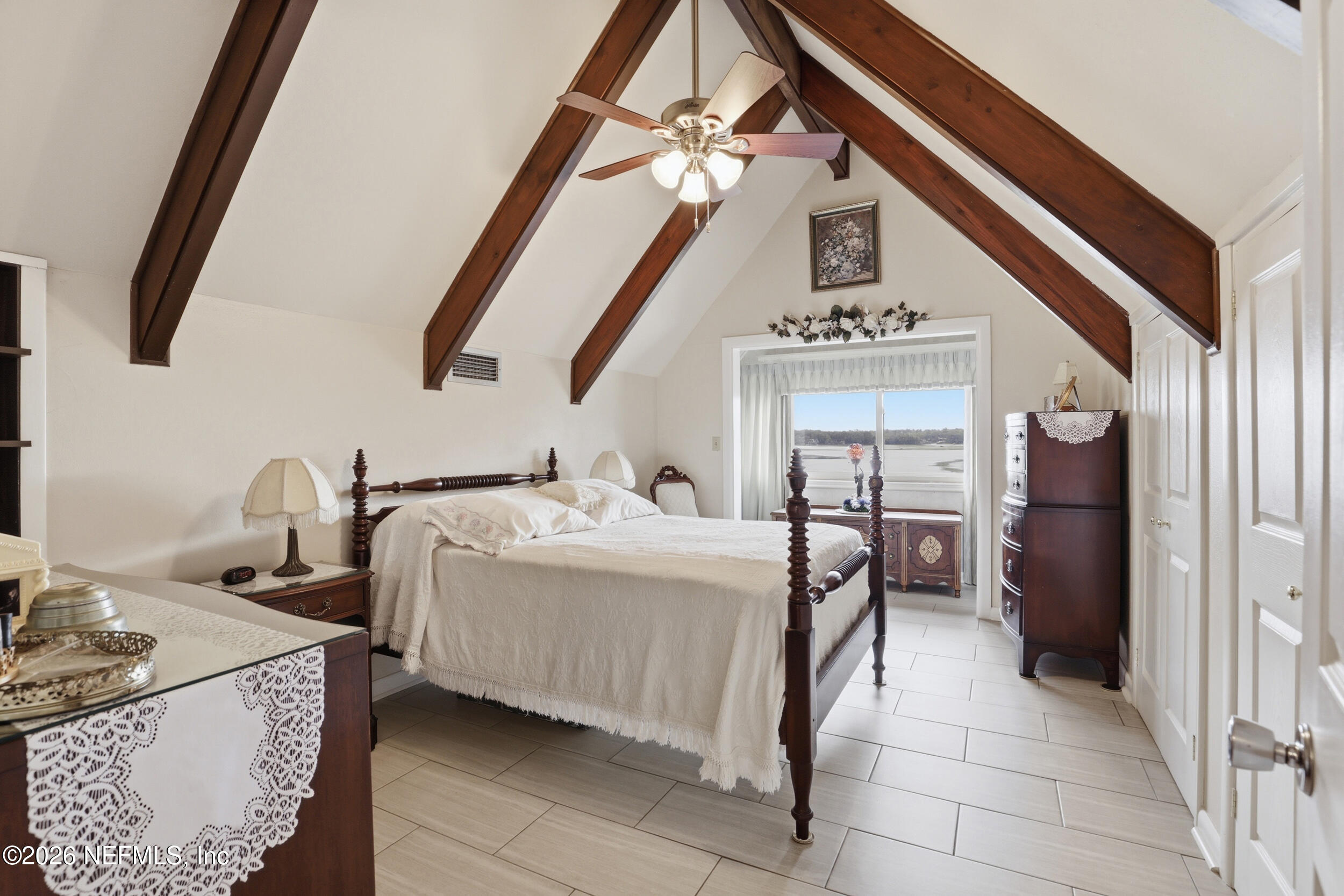 295 Northwest Berea Avenue Keystone Heights, FL 32656 - Photo 26 of 49 a bedroom with furniture and a window