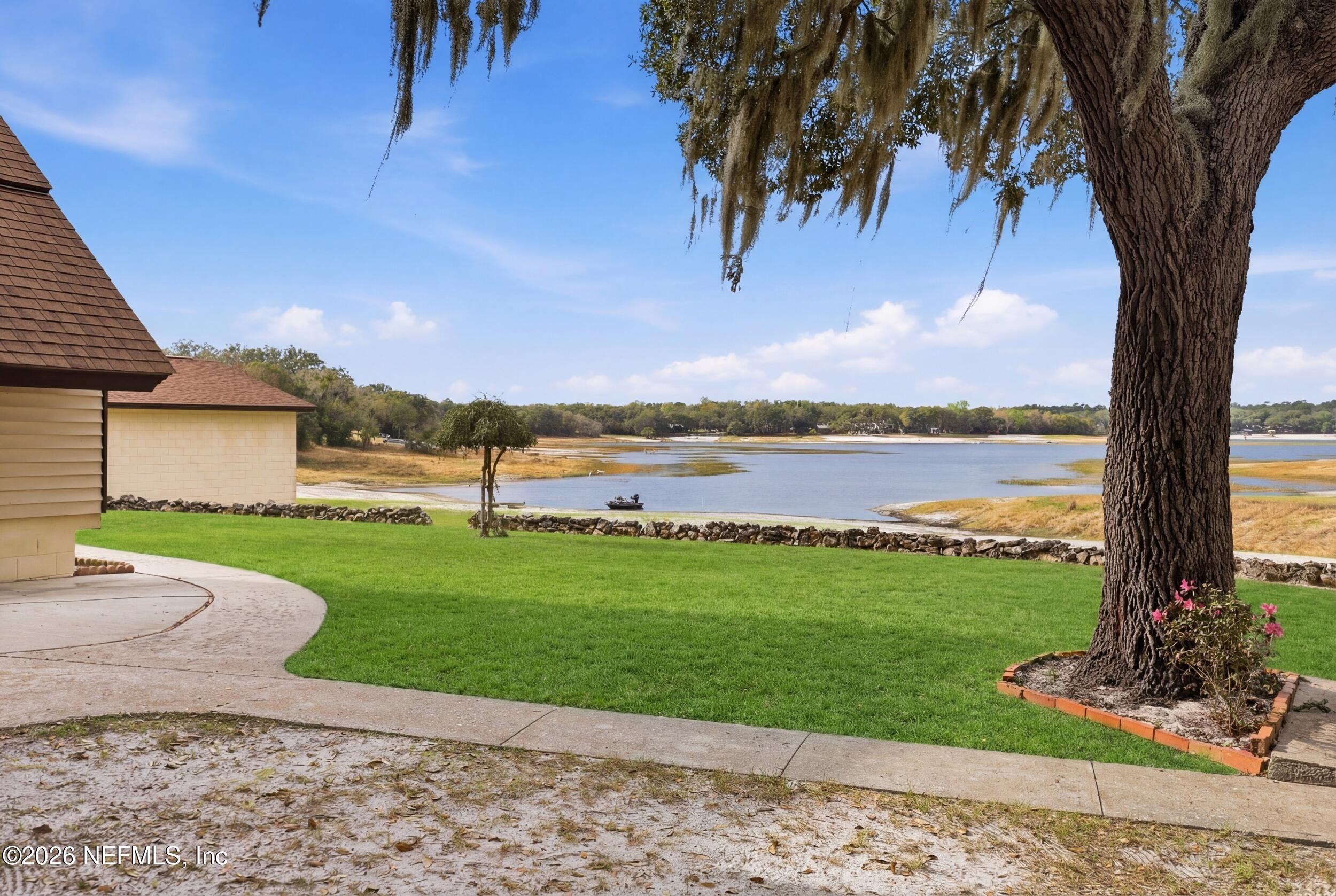295 Northwest Berea Avenue Keystone Heights, FL 32656 - Photo 34 of 49 a view of a garden with a house