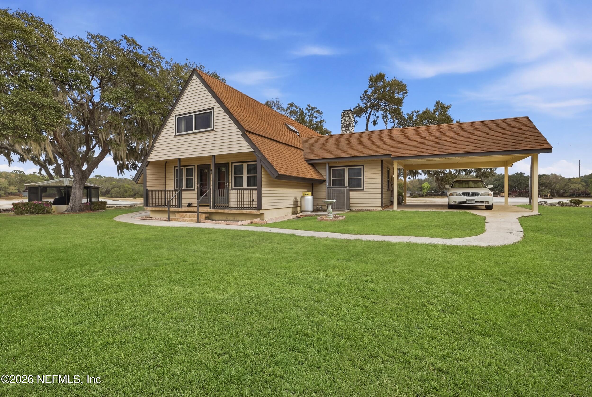 295 Northwest Berea Avenue Keystone Heights, FL 32656 - Photo 37 of 49 a front view of a house with a yard