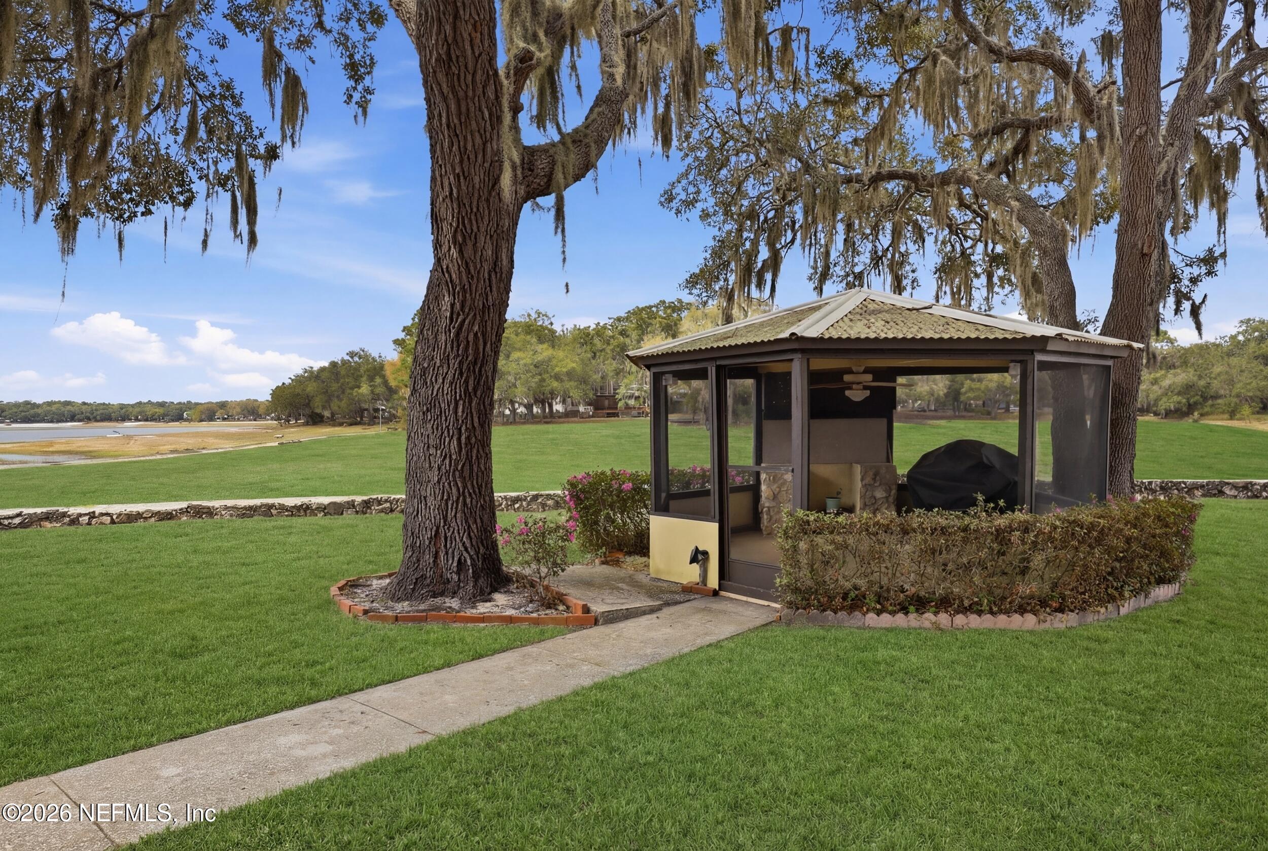 295 Northwest Berea Avenue Keystone Heights, FL 32656 - Photo 39 of 49 a front view of a house with garden