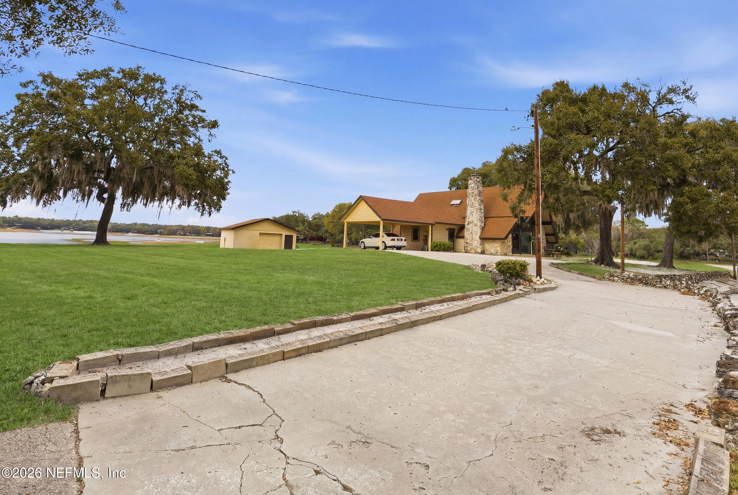 295 Northwest Berea Avenue Keystone Heights, FL 32656 - Photo 46 of 49 a view of a street with a houses