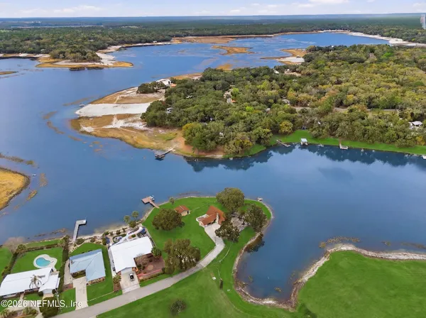an aerial view of a house with lake view