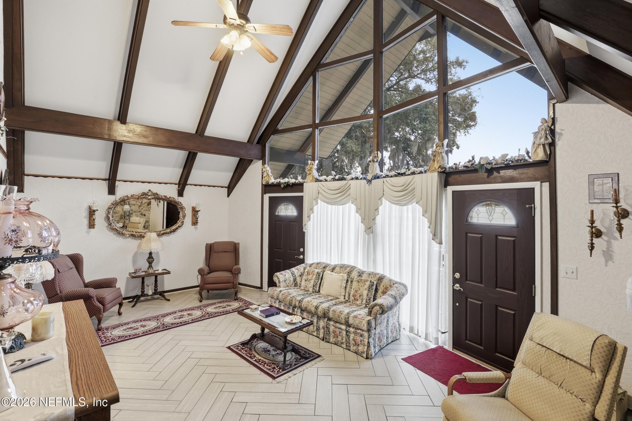 295 Northwest Berea Avenue Keystone Heights, FL 32656 - Photo 7 of 49 a living room with furniture and a window