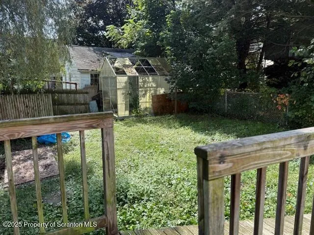 a view of backyard with green space