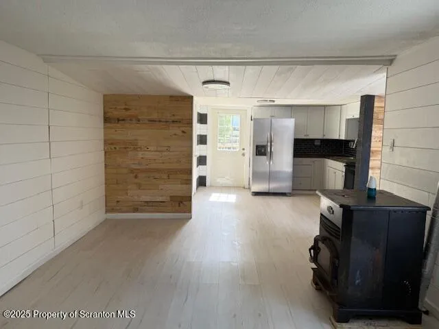 a view of an empty room with a fireplace