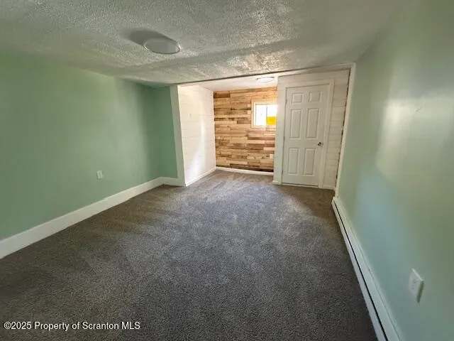 a view of an empty room and a window