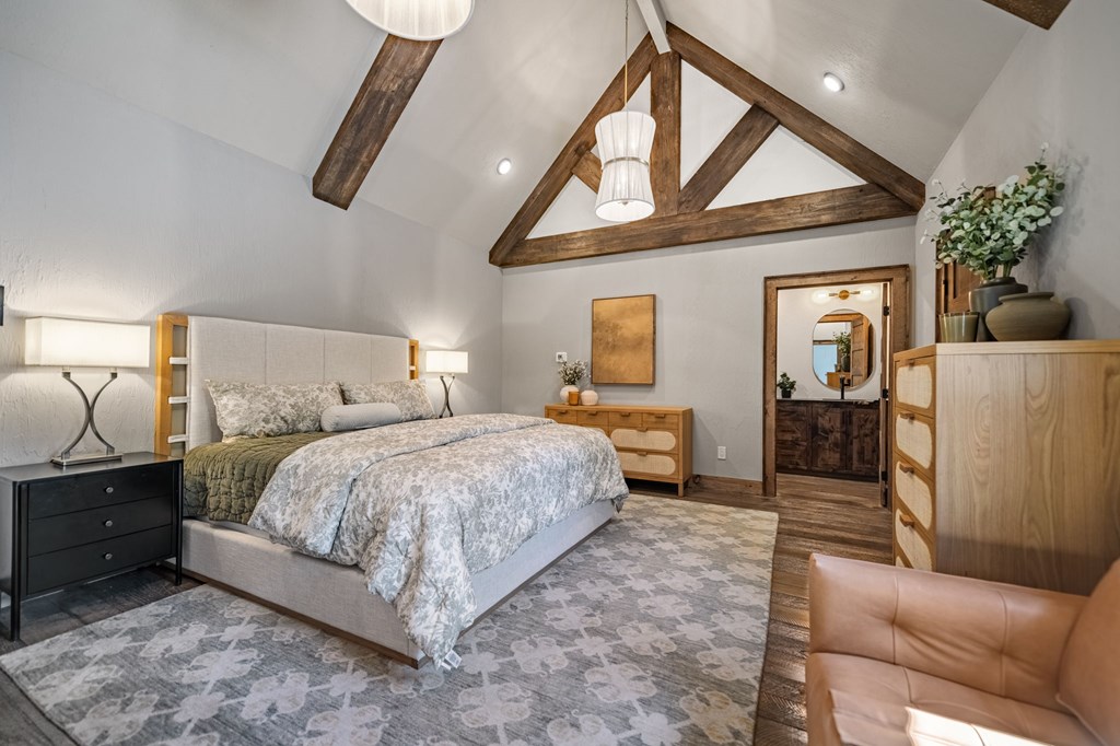 701 Eaton Road Blue Ridge, GA 30513 - Photo 54 of 98 a bed room with a bed and a chandelier