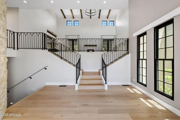 a view of staircase with wooden floor