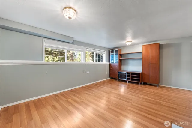 a view of room with window and piano