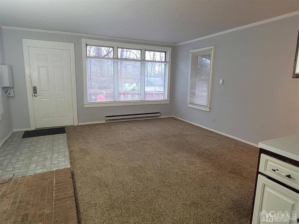 302 Schoolhouse Road, Unit B Monroe Township, NJ 08831 - Photo 3 of 8 a view of an empty room with a window