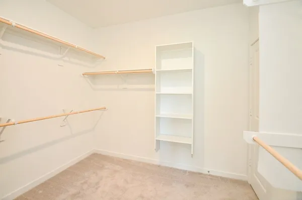 a view of an empty walk in closet