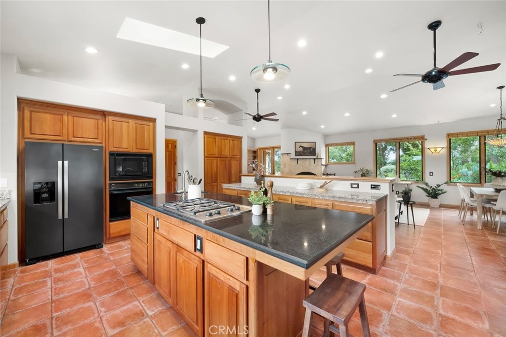 5982 Violeta Avenue Atascadero, CA 93422 - Photo 11 of 75 a kitchen with stainless steel appliances granite countertop a sink a stove and refrigerator