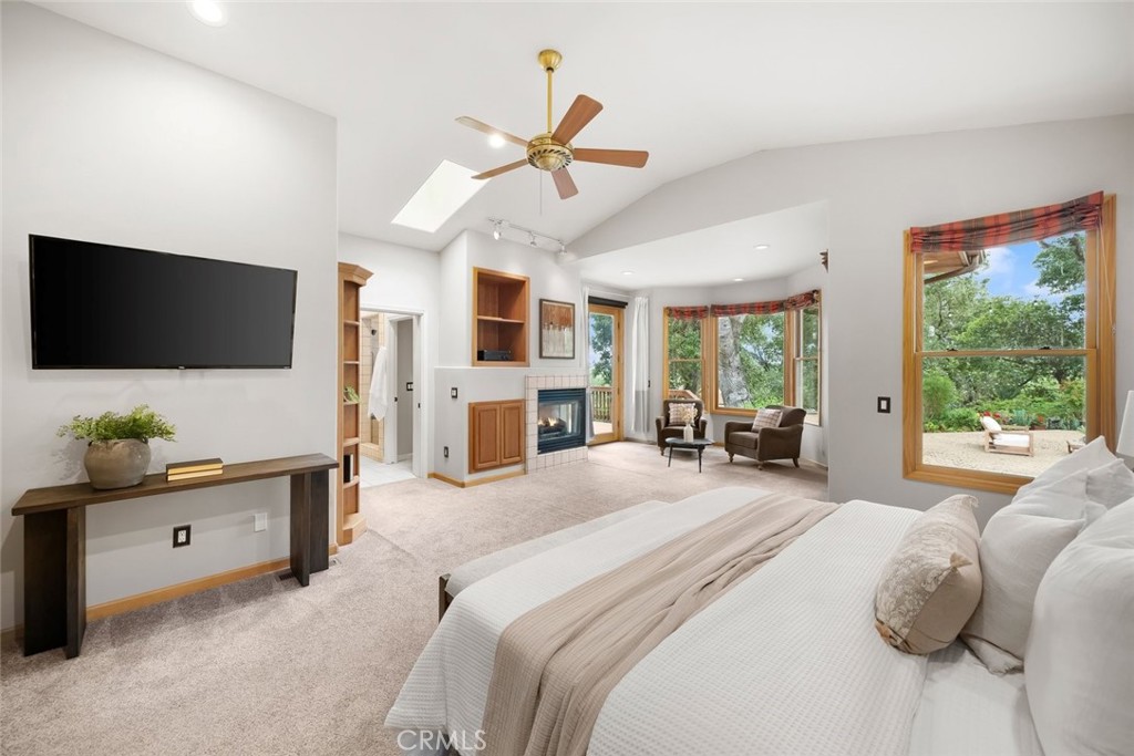 5982 Violeta Avenue Atascadero, CA 93422 - Photo 22 of 75 a bedroom with furniture and a flat screen tv