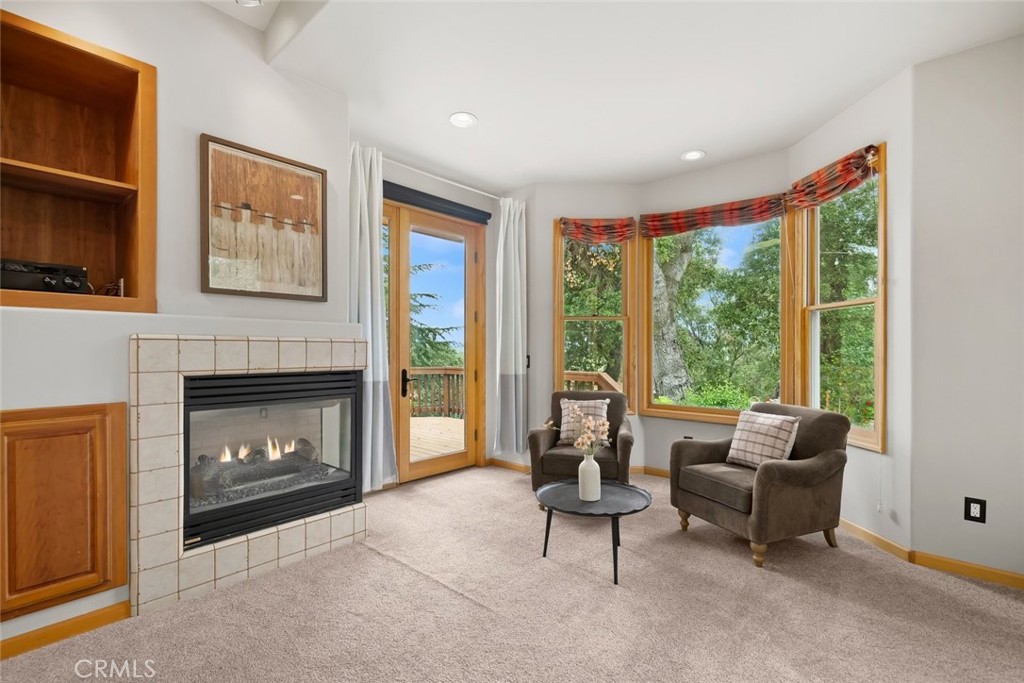 5982 Violeta Avenue Atascadero, CA 93422 - Photo 23 of 75 a living room with furniture and a fireplace