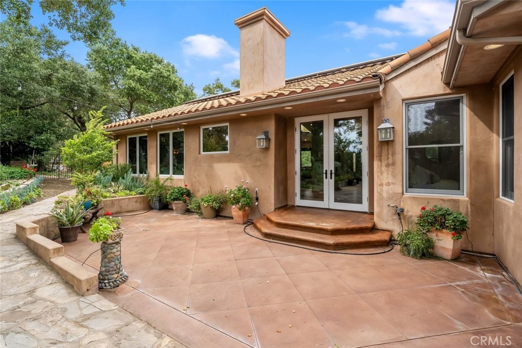 5982 Violeta Avenue Atascadero, CA 93422 - Photo 49 of 75 a front view of a house with a yard and potted plants