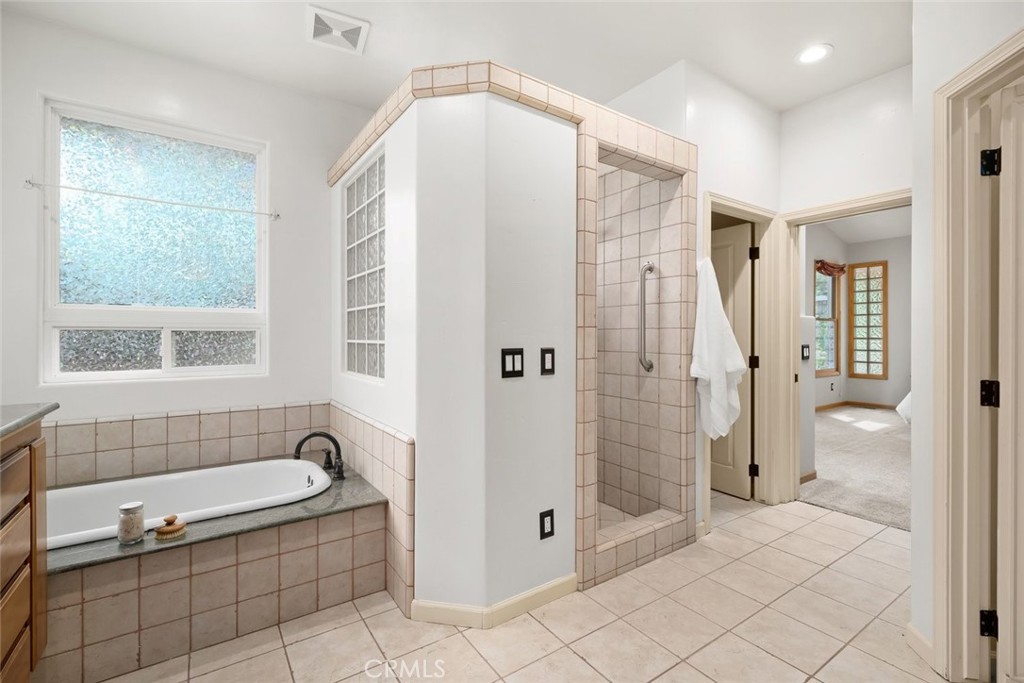 5982 Violeta Avenue Atascadero, CA 93422 - Photo 52 of 75 a bathroom with a tub shower and sink