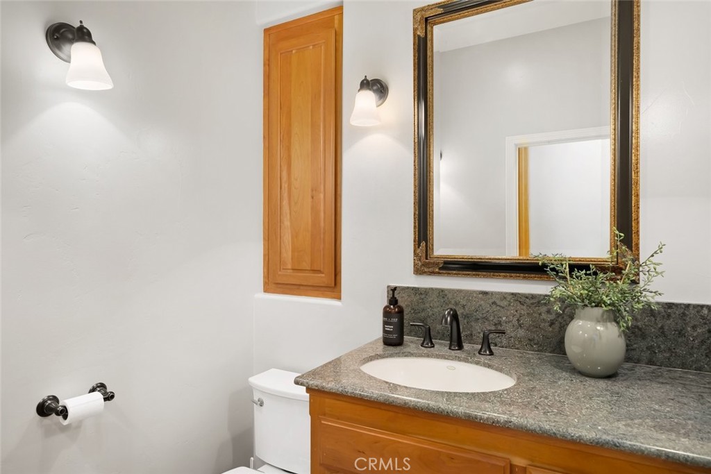 5982 Violeta Avenue Atascadero, CA 93422 - Photo 63 of 75 a bathroom with a granite countertop sink and a mirror