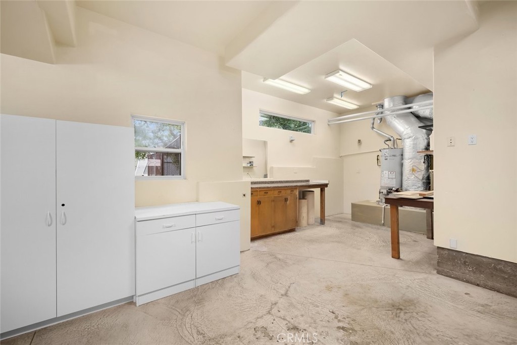 5982 Violeta Avenue Atascadero, CA 93422 - Photo 68 of 75 a view of a kitchen with a sink and dishwasher a refrigerator with white cabinets