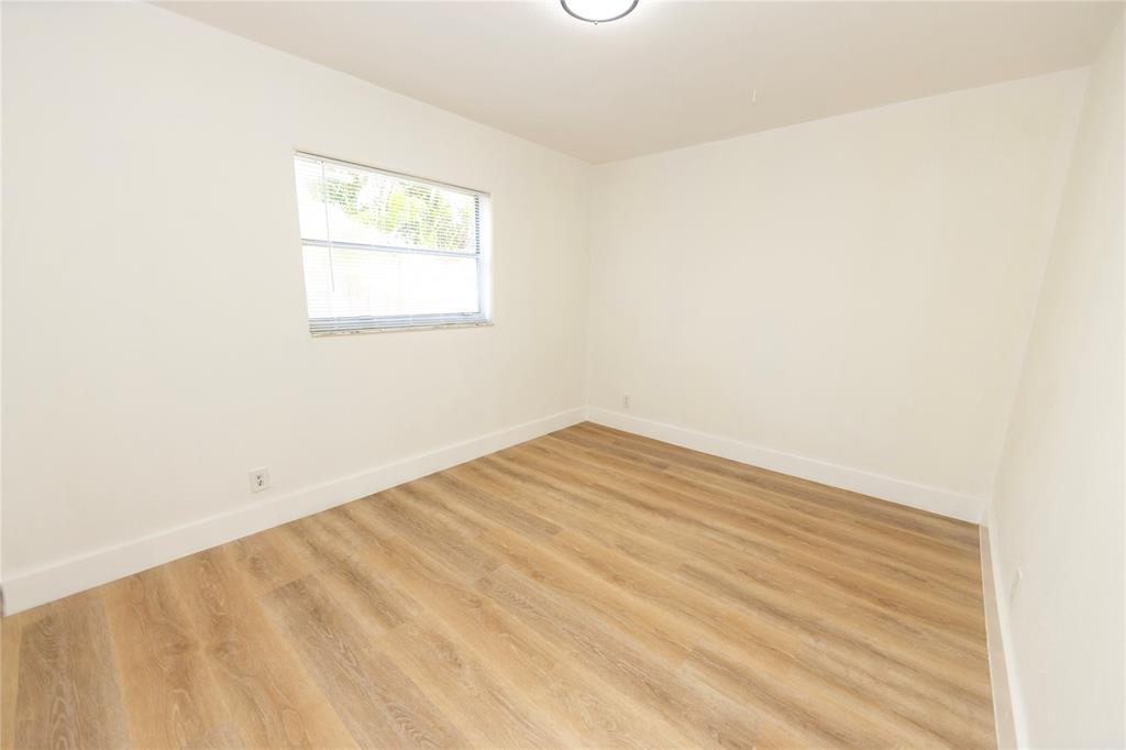 2510 Northeast 3rd Avenue Pompano Beach, FL 33064 - Photo 13 of 23 an empty room with a window