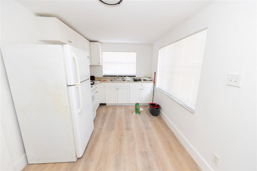 2510 Northeast 3rd Avenue Pompano Beach, FL 33064 - Photo 10 of 23 a view of a kitchen with wooden floor