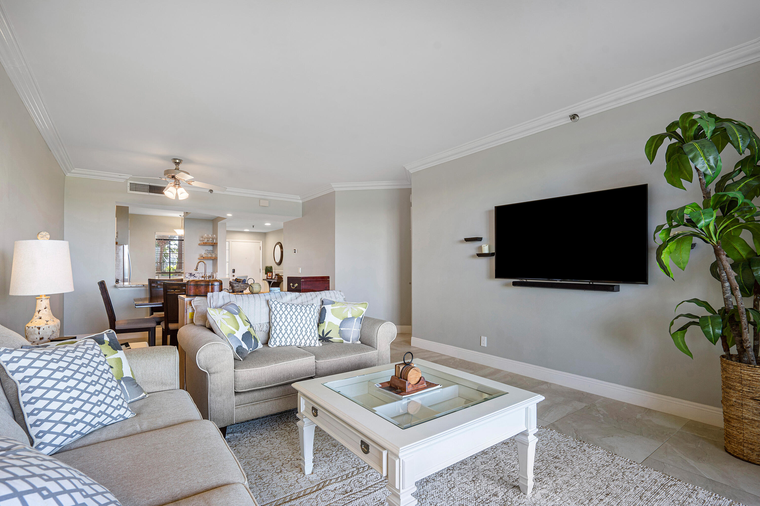 200 Waterway Road, Unit 204 Tequesta, FL 33469 - Photo 12 of 34 a living room with furniture and a flat screen tv